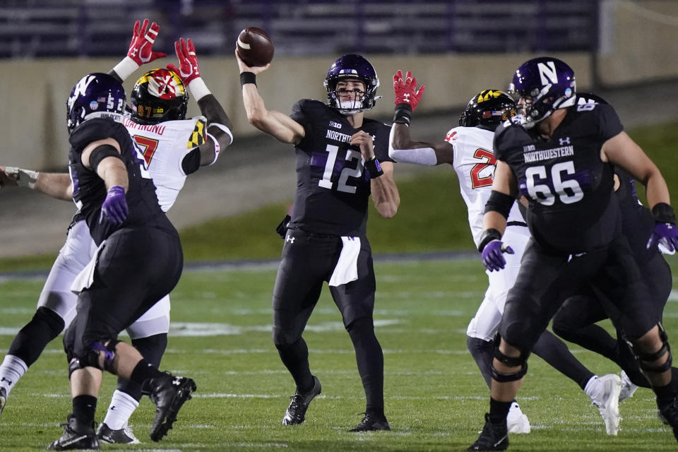 Northwestern quarterback Peyton Ramsey (12) throws a pass against Maryland during the first half of an NCAA college football game in Evanston, Ill., Saturday, Oct. 24, 2020. (AP Photo/Nam Y. Huh)