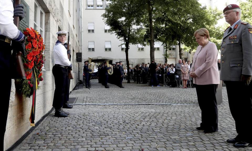 German Chancellor Angela Merkel, second right, attends a memorial event at the Defence Ministry in Berlin, Germany, Saturday, July 20, 2019. On July 20, 2019 Germany marks the 75th anniversary of the failed attempt to kill Hitler in 1944. (AP Photo/Michael Sohn)