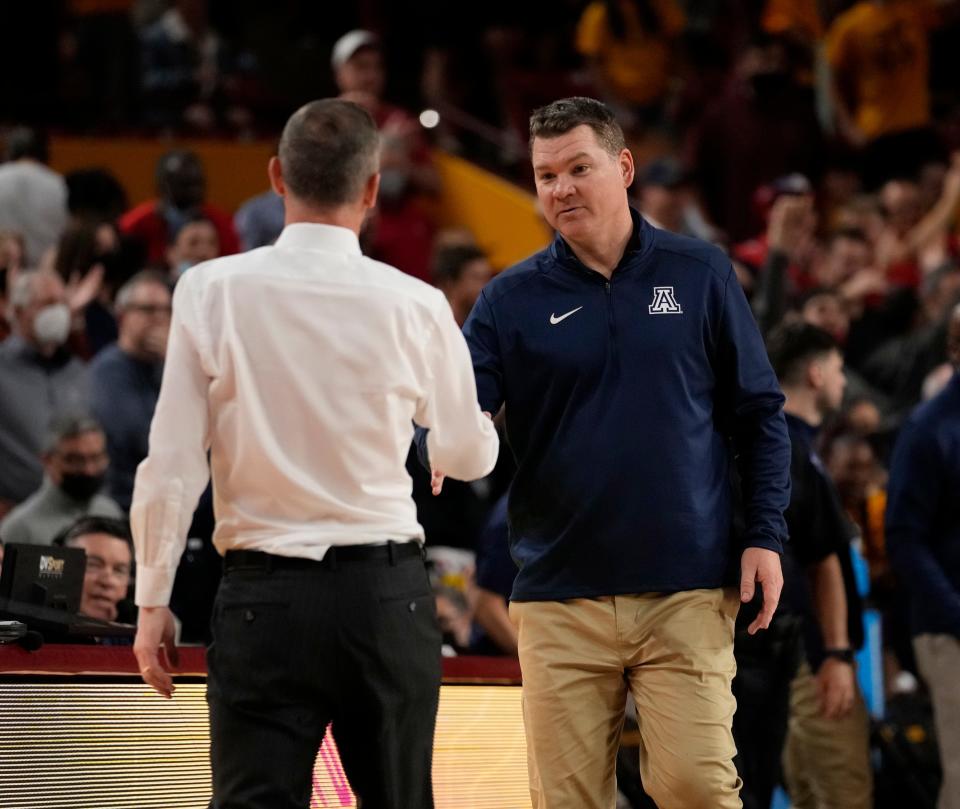 Arizona State head coach Bobby Hurley shakes hands with Arizona head coach Tommy Lloyd after a game last season.