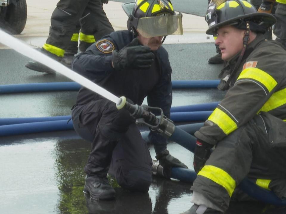 Firefighters from Fredericton, Halifax and Moncton got special training on how to best respond to fires that break out in buildings taller than three storeys. (Shane Fowler/CBC - image credit)