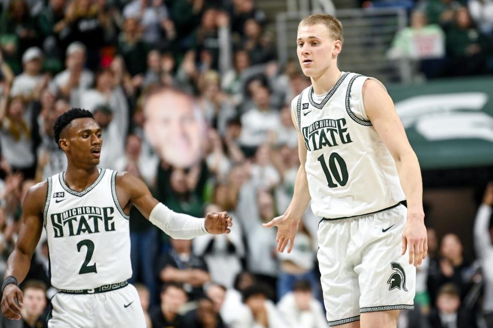 Michigan State's Joey Hauser, right, celebrates his 3-pointer with Tyson Walker, left, against Iowa during the second half on Thursday, Jan. 26, 2023, at the Breslin Center in Lansing.