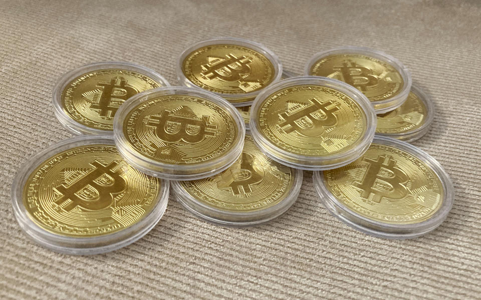 Tokens bearing the bitcoin logo. Photo: STRF/Star Max/IPx/AP