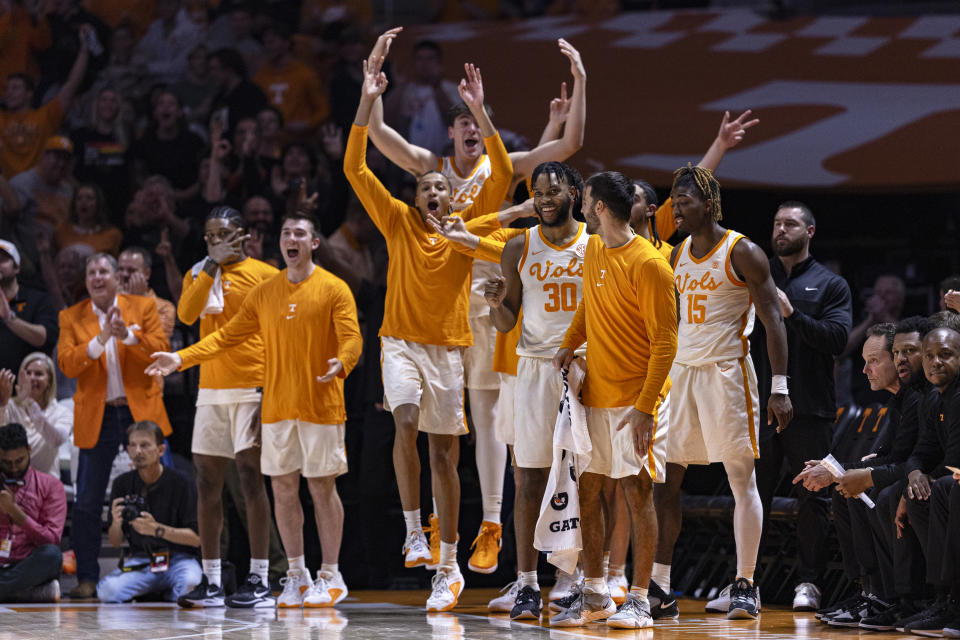 Tennessee players react to a 3-point shot by guard Dalton Knecht during the second half of an NCAA college basketball game against Auburn, Wednesday, Feb. 28, 2024, in Knoxville, Tenn. (AP Photo/Wade Payne)