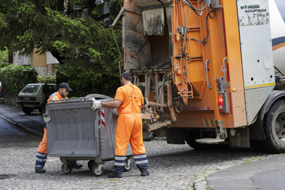 Garbage men working