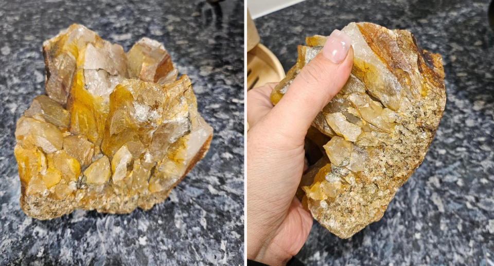 Large gold crystallised quartz stone on the woman's kitchen counter.