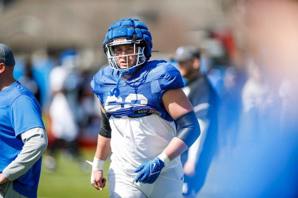 Kentucky offensive lineman Jager Burton (62) on the field in-between drills during an open practice at the training facility in Lexington, Ky., Saturday, April 1, 2022.