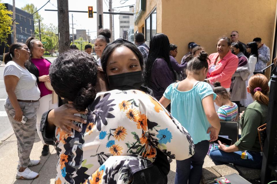 Shamika Williams, left, hugs her daughter, 18-year-old Tyauna Conway, after her completion and presentation of her GHRO (Girls Heart Reading Ohio) Your Future project Saturday afternoon at Femergy. The goal of the GHRO program is to help young girls learn the necessary skills to become leaders.