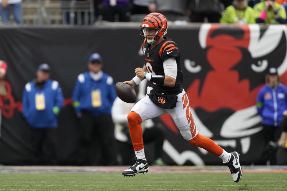 Cincinnati Bengals quarterback Joe Burrow runs during the second half of an NFL football game against the Seattle Seahawks, Sunday, Oct. 15, 2023, in Cincinnati. (AP Photo/Carolyn Kaster)