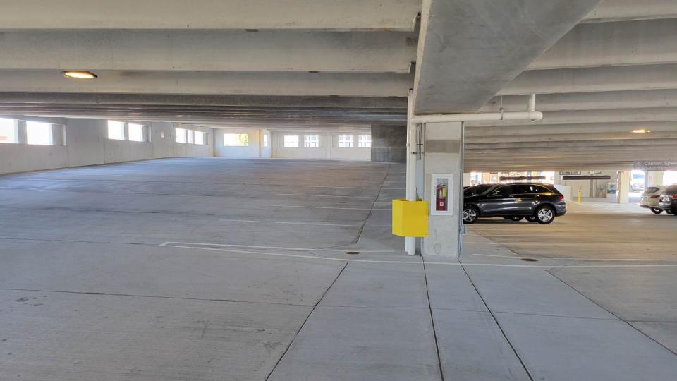 The second level of the new parking deck is mostly vacant during the late morning hours of March 29.