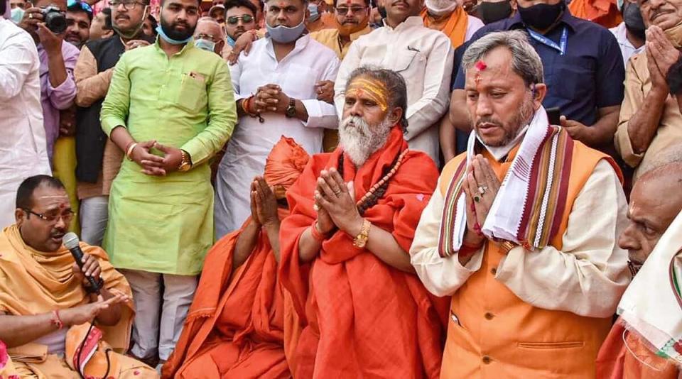 Tirath Singh Rawat at Kumbh Mela without a mask