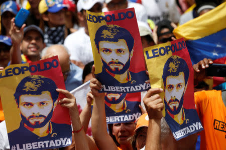 Placards depicting Venezuela's opposition leader Leopoldo Lopez, who has been granted house arrest after more than three years in jail, are seen during a rally against Venezuelan President Maduro's government in Caracas. REUTERS/Andres Martinez Casares