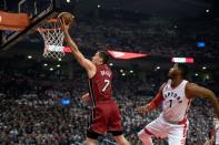 May 15, 2016; Toronto, Ontario, CAN; Miami Heat guard Goran Dragic (7) drives to the basket as Toronto Raptors forward Jason Thompson (1) defends during the first quarter in game seven of the second round of the NBA Playoffs at Air Canada Centre. Mandatory Credit: Nick Turchiaro-USA TODAY Sports