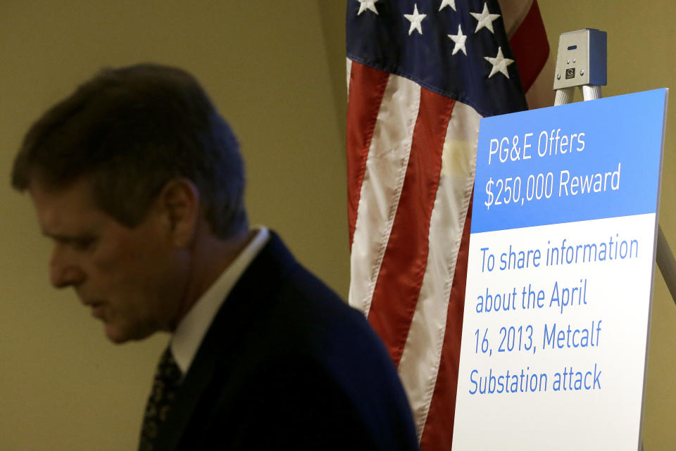 James Fama, vice president of energy delivery for Edison Electric Institute, speaks next to a Pacific Gas & Electric Co. reward sign at a news conference in San Francisco, Thursday, April 10, 2014. PG&E offered a $250,000 reward on Thursday for information leading to an arrest and conviction in an attack nearly a year ago on phone lines and the power grid in Silicon Valley. (AP Photo/Jeff Chiu)