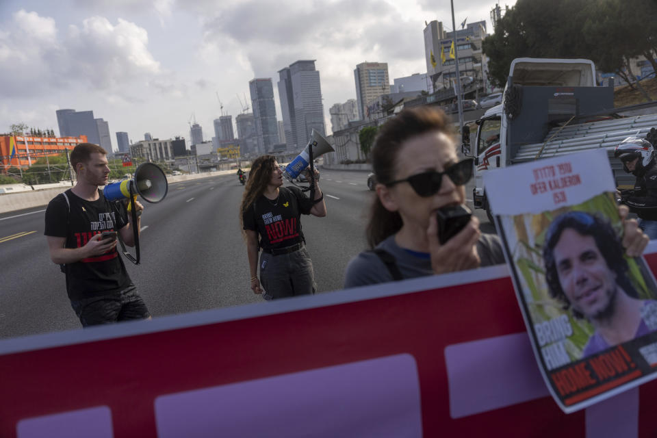 Activists block a highway as they demand the release of the hostages from Hamas captivity in the Gaza Strip, in Tel Aviv, Israel, Thursday, May 2, 2024. (AP Photo/Ohad Zwigenberg)