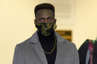 Abimbola "Able" Osundairo, walks through the lobby of the Leighton Criminal Courthouse courtroom during a lunch break in the trial of actor Jussie Smollett Wednesday, Dec. 1, 2021, in Chicago. Osundairo is expected to testify in the trial of Smollett who is accused of lying to police when he reported he was the victim of a racist, anti-gay attack in downtown Chicago nearly three years ago, in Chicago. (AP Photo/Charles Rex Arbogast)