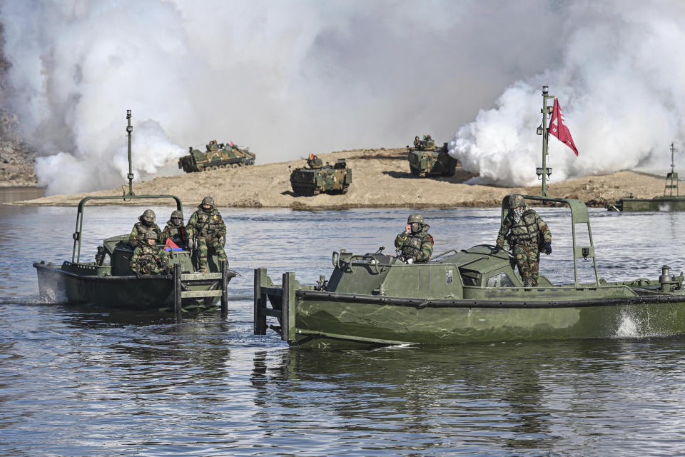 In this photo provided by South Korea Defense Ministry, South Korean soldiers on the boats conduct during a joint river-crossing drill between South Korea and the United States in Yeoncheon, South Korea, Monday, March 13, 2023. (South Korea Defense Ministry via AP)