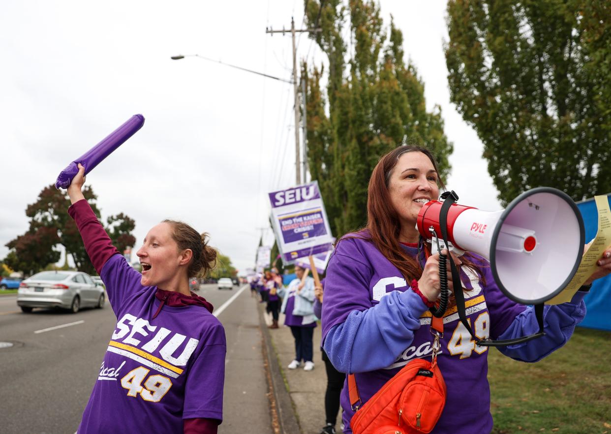 Urgent care Licensed Practical Nurses Tabetha Wingett and Jayna Braden strike with fellow Kaiser Permanente workers in protest of understaffing and unfair labor practices on Oct. 4 in Salem.