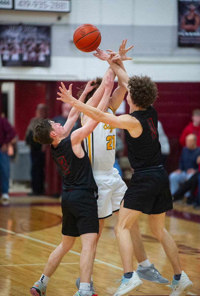 Seneca East's Aidan Hines and Luke Mason knock the ball loose from Colonel Crawford's Connor McMichael.