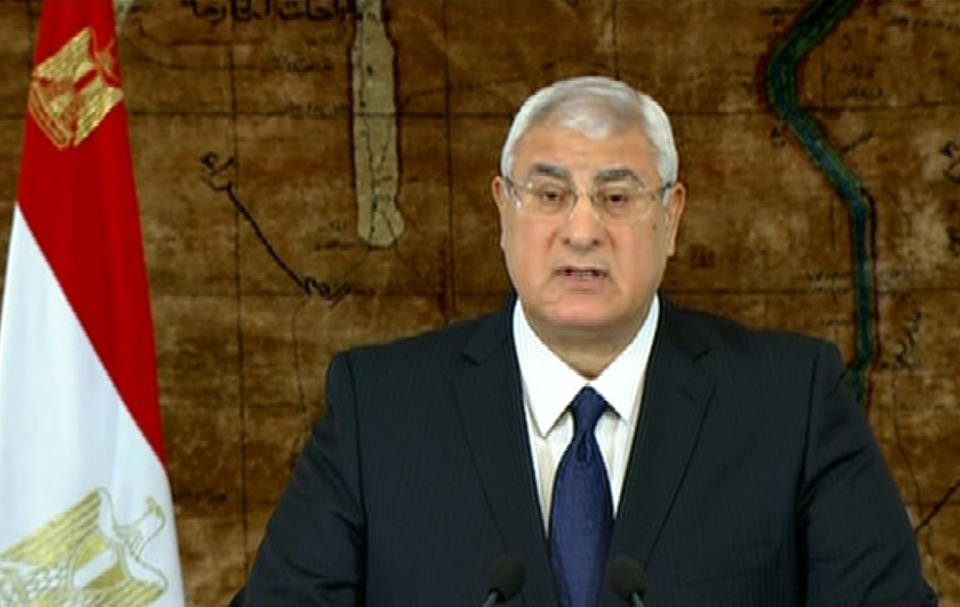 In this image made from video broadcast on Egyptian State Television, Egypt's interim President Adly Mansour speaks at the presidential palace in Cairo, Egypt, Sunday, Jan. 26, 2014. Egypt's interim president says he is amending the country's transitional plan to allow for presidential elections before parliamentary polls. According to Egypt's new constitution, the presidential vote is to be held before the second half of April, 2014. (AP Photo/Egyptian State Television)