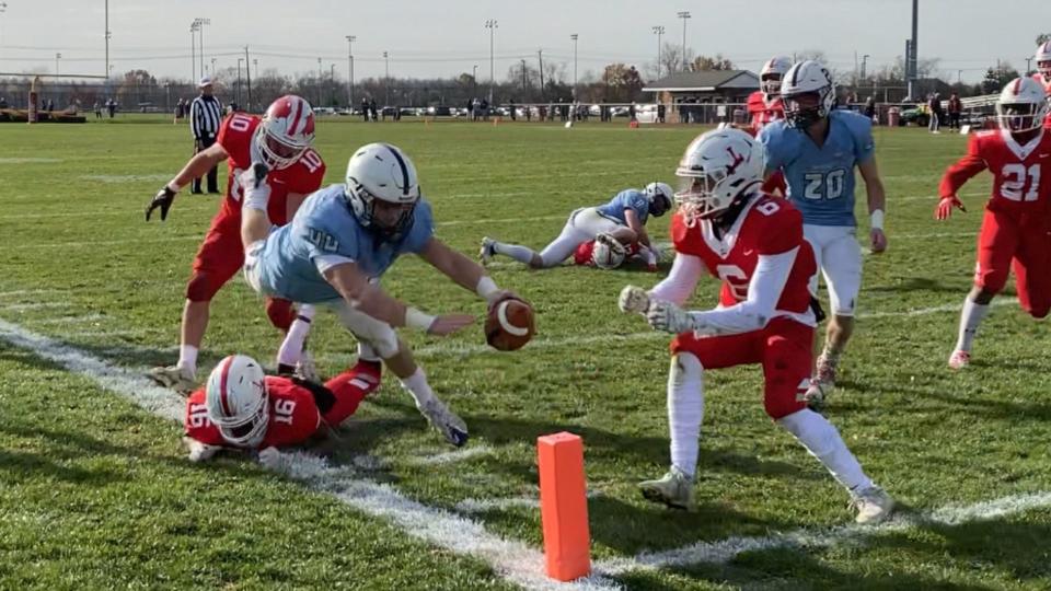 Shawnee quarterback Matt Welsey (44) dives for the pylon to finish off a 9-yard touchdown run during the second quarter of the Renegades' Thanksgiving Day meeting with Lenape on November 25, 2021.