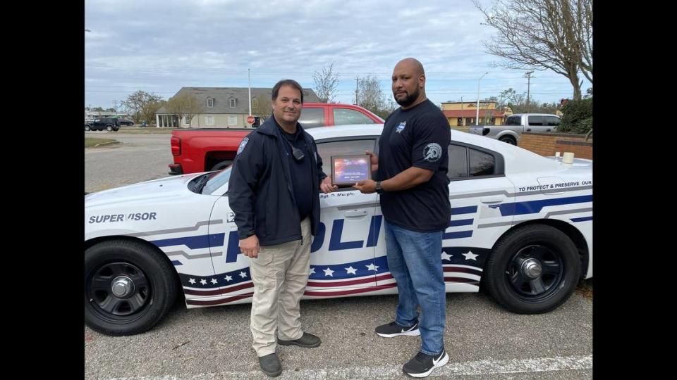 In this December 2020 picture from the Bay St. Louis Police Department, former federal agent, local police officer, and current Hancock County Deputy Benjamin “Ben” Taylor, is recognized for his outstanding service in the city of Waveland.