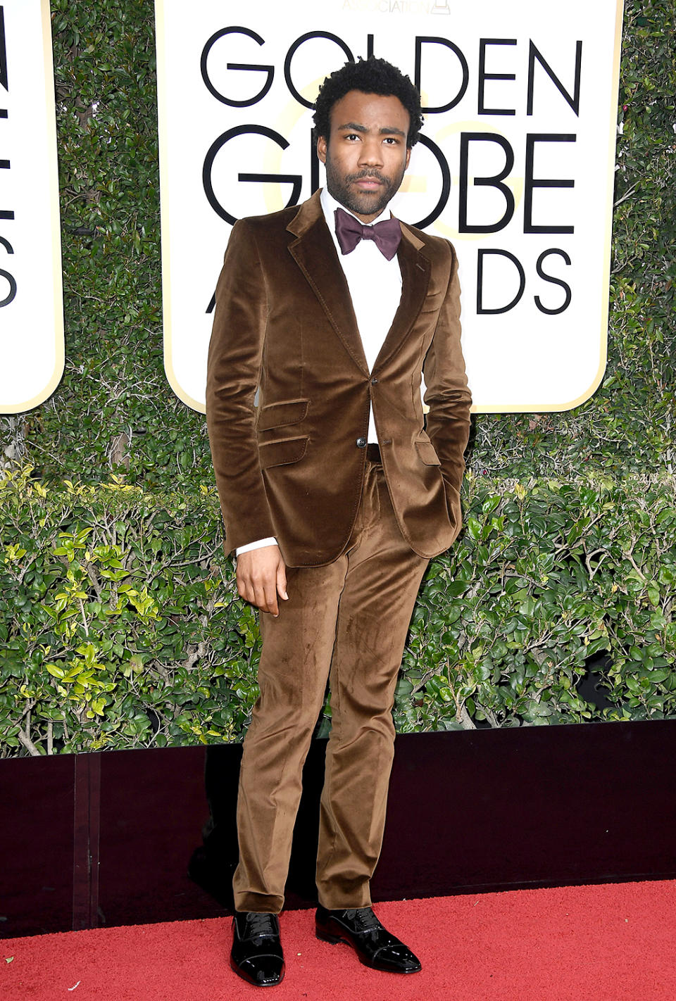 <p>Wearing a brown velvet suit by Gucci. [Photo: Getty] </p>