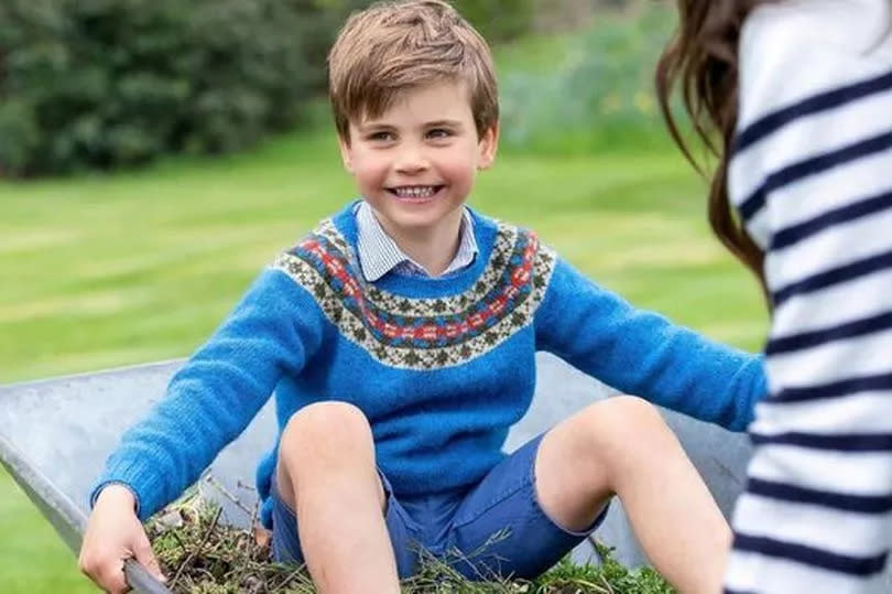 Prince Louis in wheelbarrow