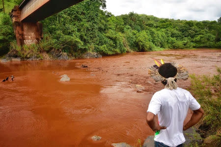An Indigenous man from the Pataxo Ha-ha-hae tribe looks at Paraopeba river, after a tailings dam owned by Brazilian mining company Vale SA collapsed, in Sao Joaquim de Bicas near Brumadinho, Brazil January 25, 2019. REUTERS/FUNAI/Handout via Reuters