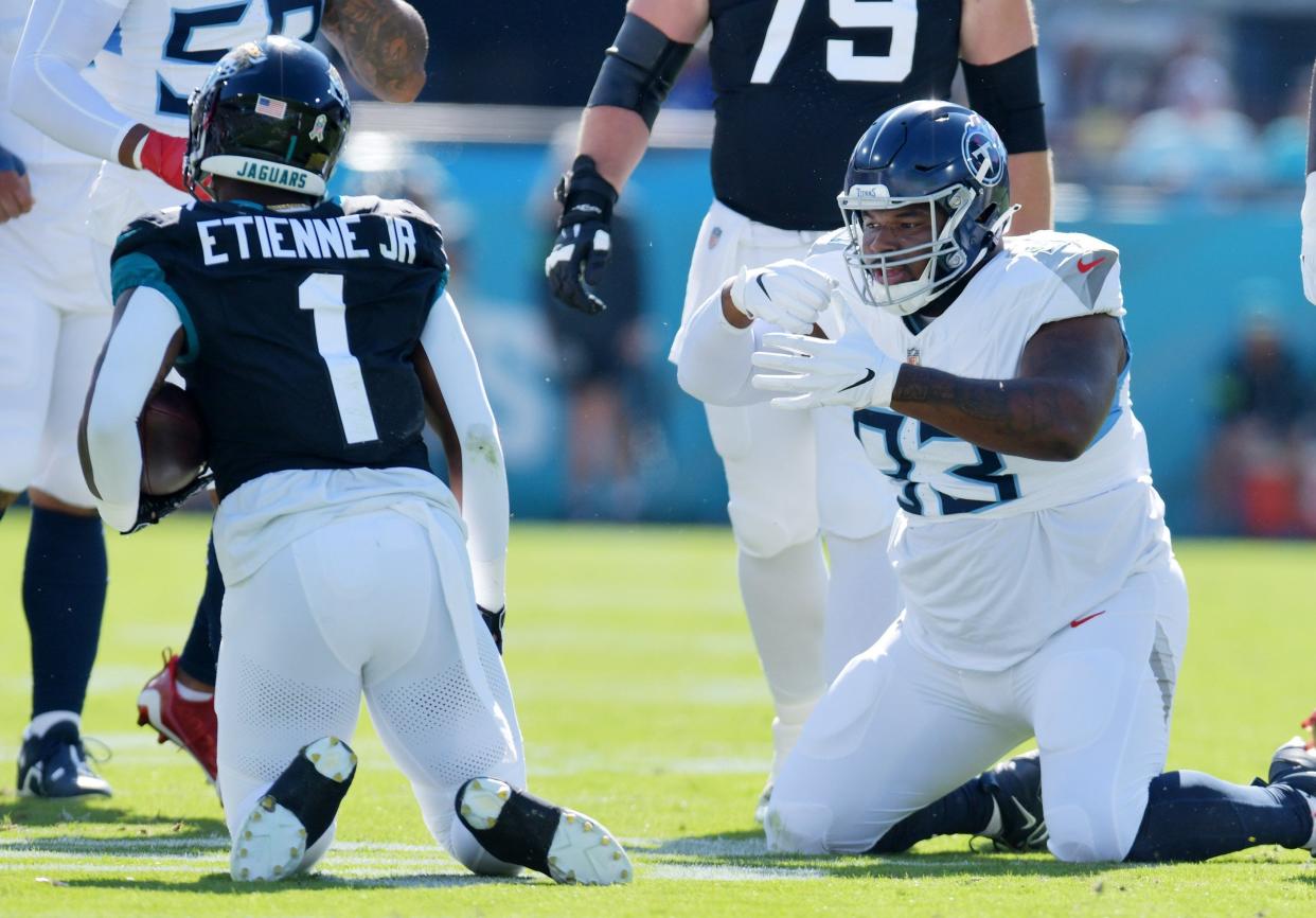 Tennessee Titans Teair Tart (93) makes an eating motion after a late first quarter tackle on Jacksonville Jaguars running back Travis Etienne Jr. (1). The Jacksonville Jaguars hosted the Tennessee Titans at EverBank Stadium in Jacksonville, FL Sunday, November 19, 2023. The Jaguars led 13 to 0 at the half. [Bob Self/Florida Times-Union]