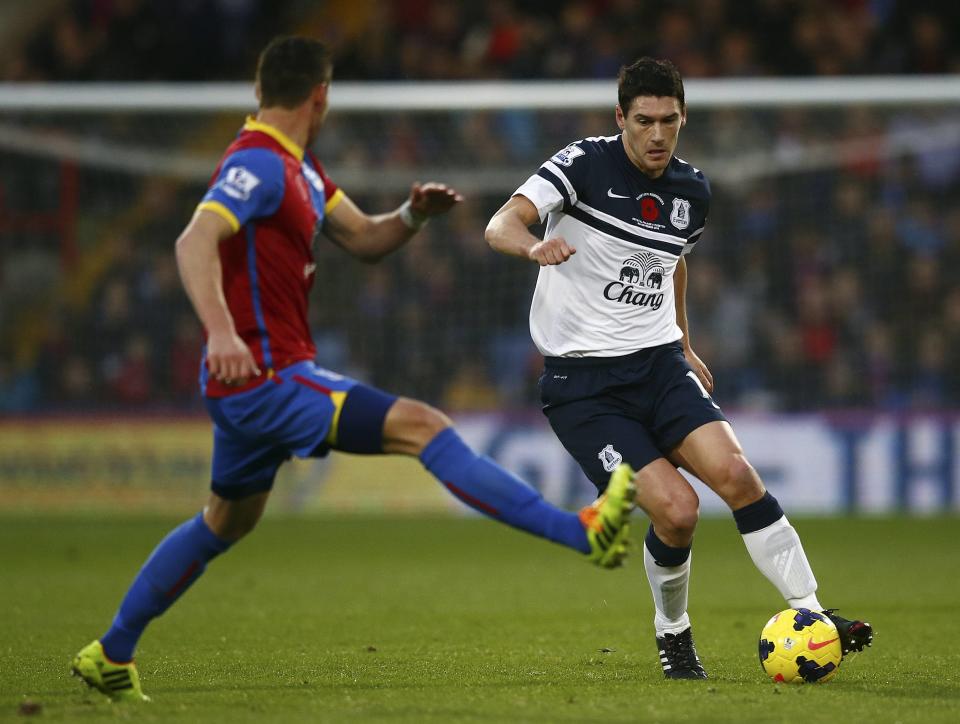 Crystal Palace's Joel Ward (L) challenges Everton's Gareth Barry during their English Premier League soccer match at Selhurst Park in London, November 9, 2013.