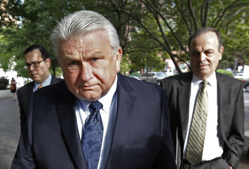 FILE - In this April 20, 2016, file photo, Harry Morel, a former district attorney for St. Charles Parish, La., arrives with his attorney Ralph Capitelli, right, at federal court in New Orleans. Amid a whistleblower letter unsealed in April 2021, Kenneth Polite, President Joe Biden’s pick to lead the U.S. Justice Department’s criminal division, is facing new scrutiny over a plea deal he brokered with Morel who was accused of coercing sexual favors from as many as two dozen women. (AP Photo/Gerald Herbert, File)