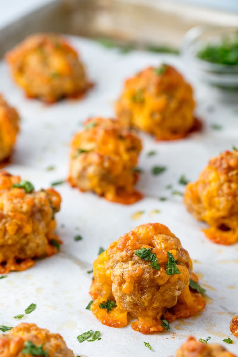 <p>In many households, sausage balls are a classic <a href="https://www.delish.com/holiday-recipes/christmas/g1713/holiday-party-appetizers/" rel="nofollow noopener" target="_blank" data-ylk="slk:holiday appetizer" class="link ">holiday appetizer</a>. But many of you might be thinking: <em>Wait, what even is a sausage ball?! </em>The answer: savory, cheesy bites of cooked <a href="https://www.delish.com/cooking/g2027/sausage-recipes-for-dinner/" rel="nofollow noopener" target="_blank" data-ylk="slk:pork sausage" class="link ">pork sausage</a>, cheddar, and <a href="https://www.delish.com/cooking/menus/g2675/brilliant-things-to-make-with-bisquick/" rel="nofollow noopener" target="_blank" data-ylk="slk:Bisquick" class="link ">Bisquick</a> that will be the most popular appetizer at your Mardi Gras party.</p><p>Get the <strong><a href="https://www.delish.com/cooking/recipe-ideas/recipes/a54969/sausage-balls-recipe/" rel="nofollow noopener" target="_blank" data-ylk="slk:Sausage Balls recipe" class="link ">Sausage Balls recipe</a></strong>.</p>