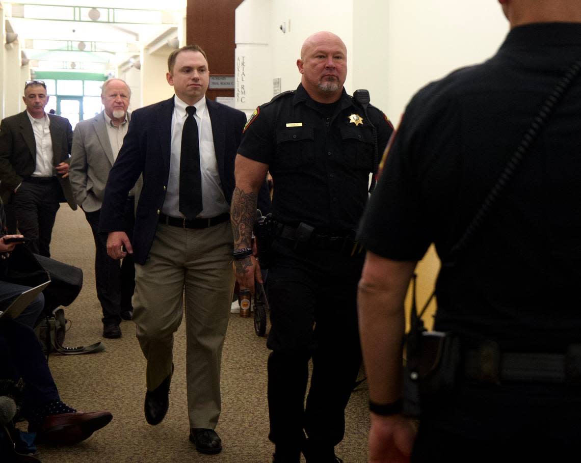 Aaron Dean walks into a pretrial hearing Nov. 16 at the Tim Curry Criminal Justice Center in downtown Fort Worth. Jury selection began Monday in the trial of Dean, a former Fort Worth police officer, on a murder charge in the 2019 shooting death of Atatiana Jefferson. Yffy Yossifor/yyossifor@star-telegram.com