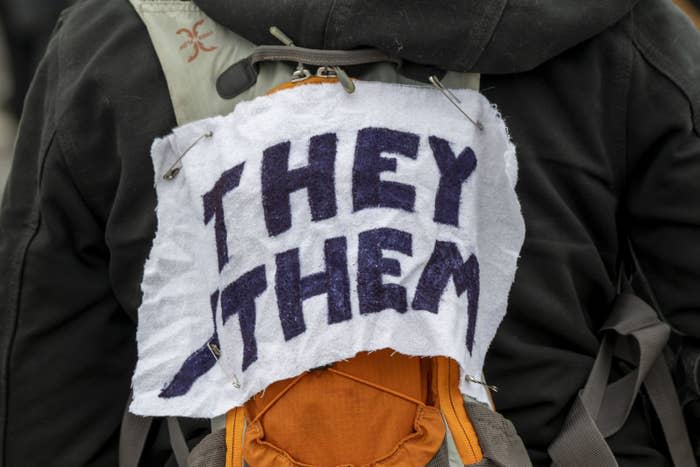 A sign saying, "They Them"