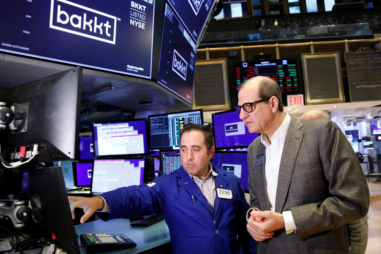 Gavin Michael, CEO of Bakkt, speaks with Specialist Gennaro Saporito during the listing of Bakkt on the New York Stock Exchange (NYSE) in New York City, U.S., October 18, 2021.  REUTERS/Brendan McDermid