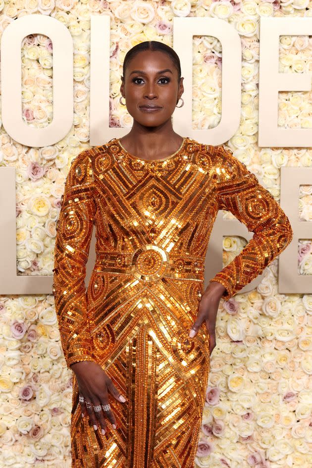 Issa Rae lit up the red carpet with a full-length gold sequined dress.