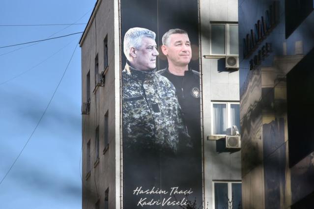 Banner displays former Kosovo President Hashim Thaci and former speaker of the parliament Kadri Veseli, in Pristina