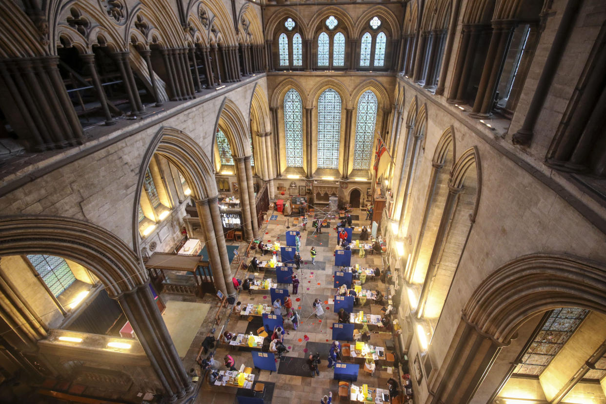 <p>Cubicles erected inside Salisbury Cathedral, Wiltshire, for people to receive an injection of the Pfizer coronavirus vaccine.</p> (PA)