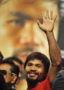 Manny Pacquiao of the Philippines greets his fans during weigh-in at the MGM Grand Arena in Las Vegas, Nevada on June 08,2012. Pacquiao and Bradley will fight on June 9. AFP PHOTO / JOE KLAMARJOE KLAMAR/AFP/GettyImages