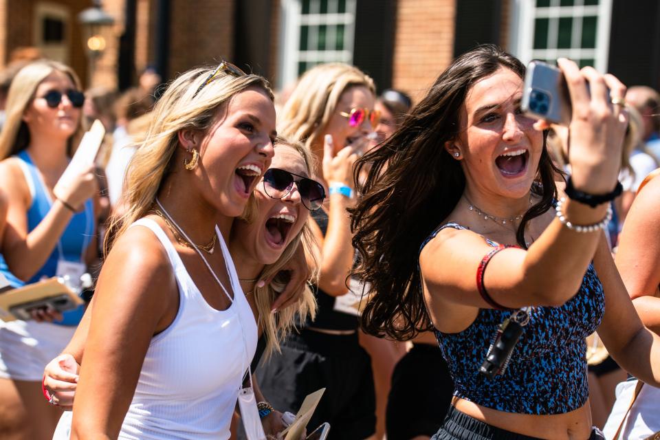 New members of Zeta Tau Alpha take a selfie as they walk out of Bryant Denny Stadium to meet their new sorority sisters on Bid Day at The University of Alabama. Sunday August 14, 2022. [Photo/Will McLelland]