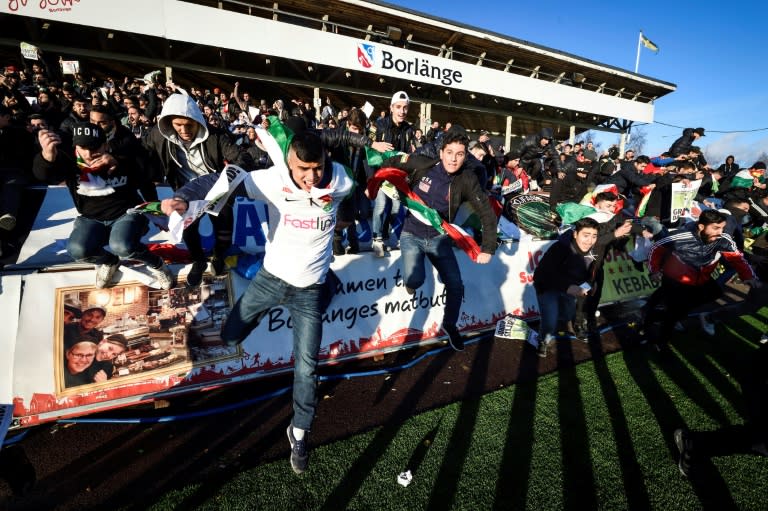 Supporters of Dalkurd FF, the Swedish football team founded by Kurdish immigrants, run on to the pitch after their team won against Gothenburg's GAIS in a Superettan (Swedish second division) match, in Borlange, on October 28, 2017