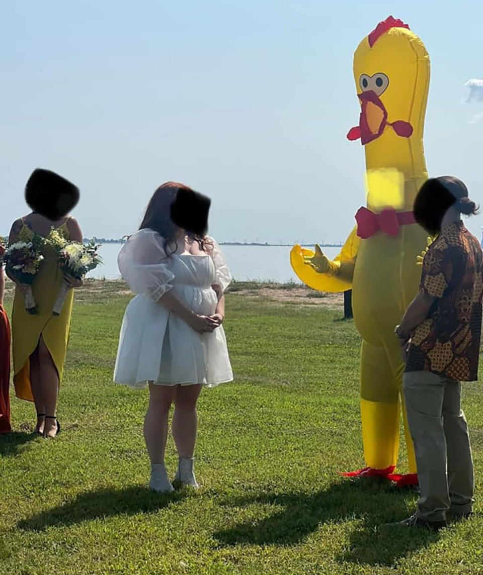 Bride and groom get married by a man in a giant chicken suit