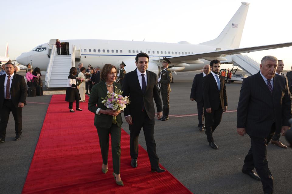 CORRECTS CREDIT - In this handout photo released by Armenian National Assembly via Photolure photo agency, Head of Armenian National Assembly Alen Simonyan, center right, and U.S. House of Representatives Nancy Pelosi, center left, walk together upon her arrival at the International Airport outside of Yerevan, Armenia, Saturday, Sept. 17, 2022. A US Congressional delegation headed by Speaker of the House Nancy Pelosi arrived Saturday in Armenian, where a cease-fire has held for three days after an outburst of fighting with neighboring Azerbaijan that killed more than 200 troops from both sides. (Armenian National Assembly via Photolure photo agency via AP)