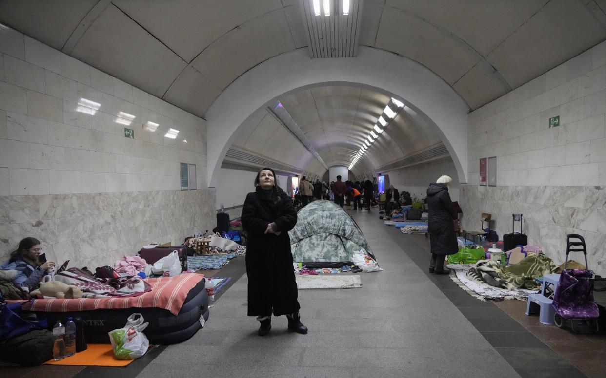 People gather in the Kyiv subway, using it as a bomb shelter in Kyiv, Ukraine, Wednesday, March 2, 2022.