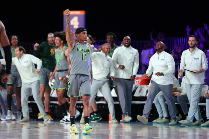 In this photo provided by Bahamas Visual Services, Baylor guard James Akinjo (11) reacts after a basket against Michigan State during an NCAA college basketball game at Paradise Island, Bahamas, Friday, Nov. 26, 2021. (Tim Aylen/Bahamas Visual Services via AP)