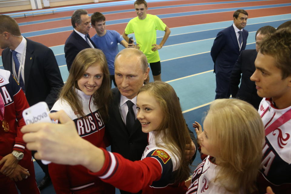 Russian President Vladimir Putin poses for a selfie with teenage athletes&nbsp;in Cheboksary, Russia, on Oct. 9, 2014.