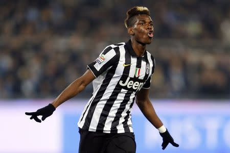 Juventus' Paul Pogba celebrates after scoring against Lazio during their Italian Serie A soccer match at Olympic stadium in Rome November 22, 2014. REUTERS/Giampiero Sposito