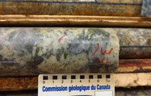 RVD21-03 at 411.50m – Epithermal style scheelite and chalcopyrite WAu breccia mineralization within argillic altered Revenue granodiorite.