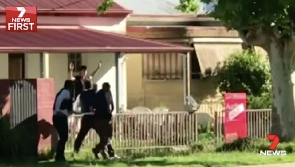 Anthony Hagan surrenders to heavily armed detectives. Source: 7 News