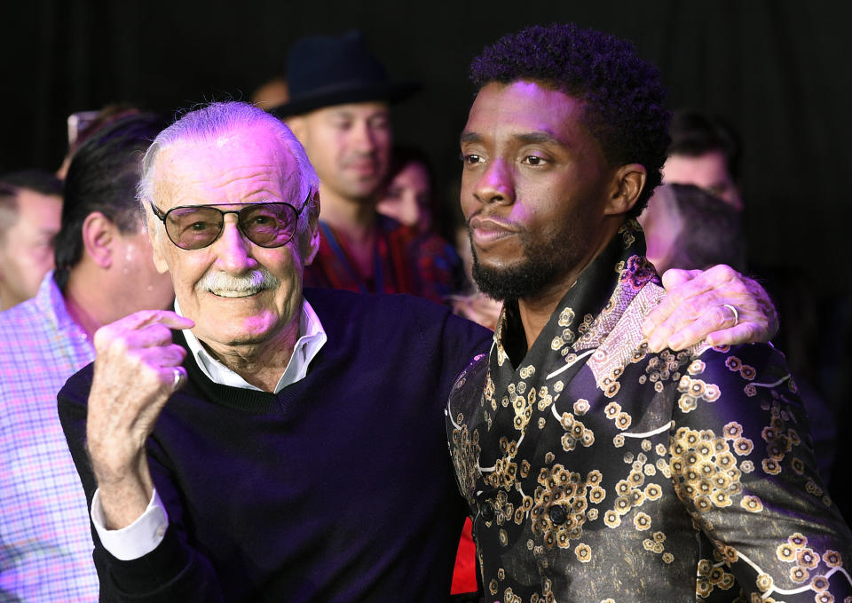 FILE - In this Jan. 29, 2018 file photo, comic book legend Stan Lee, left, creator of the "Black Panther" superhero, poses with Chadwick Boseman, star of the new "Black Panther" film, at the premiere at The Dolby Theatre in Los Angeles. Boseman, who played Black icons Jackie Robinson and James Brown before finding fame as the regal Black Panther in the Marvel cinematic universe, has died of cancer. His representative says Boseman died Friday, Aug. 28, 2020 in Los Angeles after a four-year battle with colon cancer. He was 43. (Photo by Chris Pizzello/Invision/AP, File)